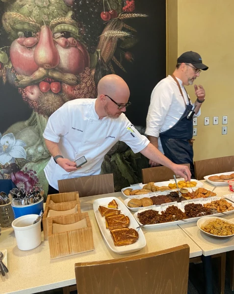 UCLA dining chefs setting out plant-based dishes